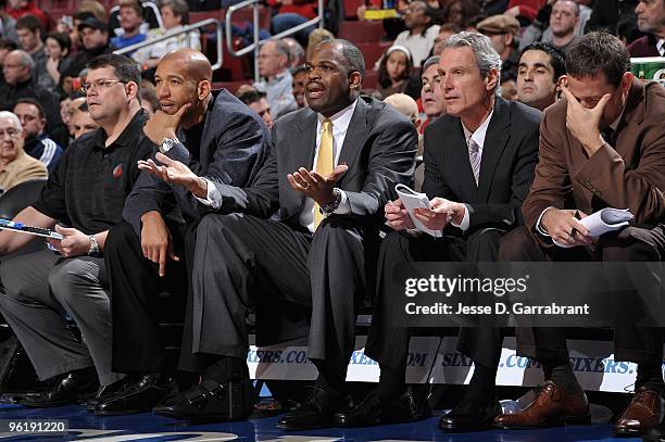 Assistant coach Monty Williams , head coach Nate McMillan and assistant coach Dean Demopoulos of the Portland Trail Blazers look on from the sideline...