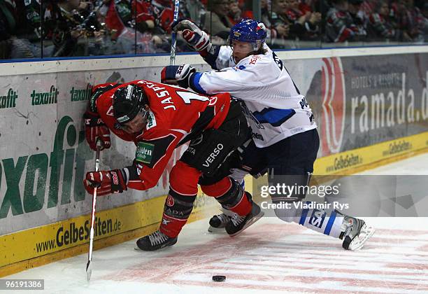 Jason Jaspers of Haie and James Pollock of Adler in action during the DEL game between Koelner Haie and Adler Mannheim at Lanxess Arena on January...