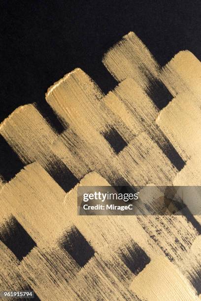 gold colored brush strokes pattern - gold glitter paint stock pictures, royalty-free photos & images