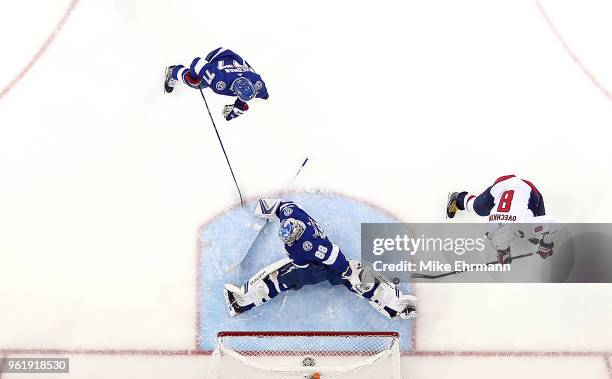 Andrei Vasilevskiy of the Tampa Bay Lightning stops a shot from Alex Ovechkin of the Washington Capitals in Game Seven of the Eastern Conference...