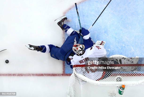 Braden Holtby of the Washington Capitals stops a shot from Brayden Point of the Tampa Bay Lightning in Game Seven of the Eastern Conference Finals...