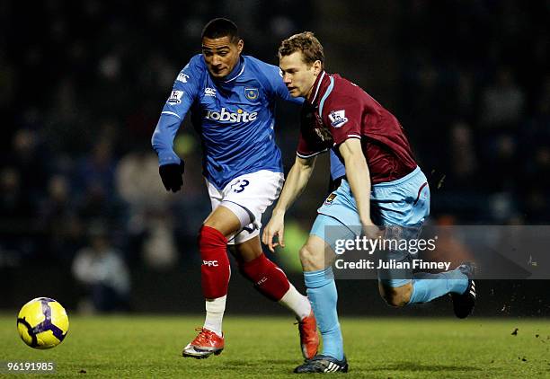 Kevin-Prince Boateng of Portsmouth battles with Jonathan Spector of West Ham during the Barclays Premier League match between Portsmouth and West Ham...