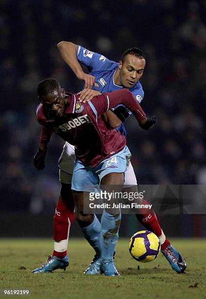 Younes Kaboul of Portsmouth battles with Frank Nouble of West Ham during the Barclays Premier League match between Portsmouth and West Ham United at...