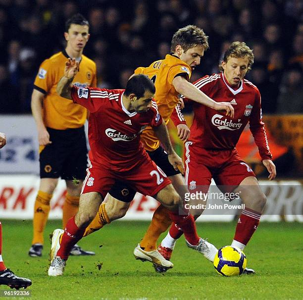 Javier Mascherano of Liverpool goes in on Kevin Doyle of Wolverhampton Wanderers during the Barclays Premier League match between Wolverhampton...