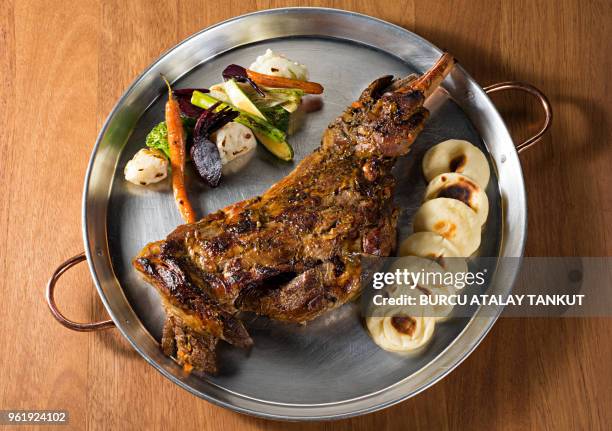 roasted leg of lamb - roast lamb stock pictures, royalty-free photos & images