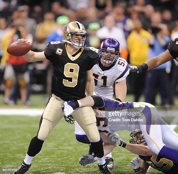 Drew Brees of the New Orleans Saints passes under pressure from Jared Allen of the Minnesota Vikings during the NFC Championship Game on January 24,...