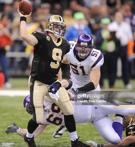 Drew Brees of the New Orleans Saints passes under pressure from Jared Allen of the Minnesota Vikings during the NFC Championship Game on January 24,...