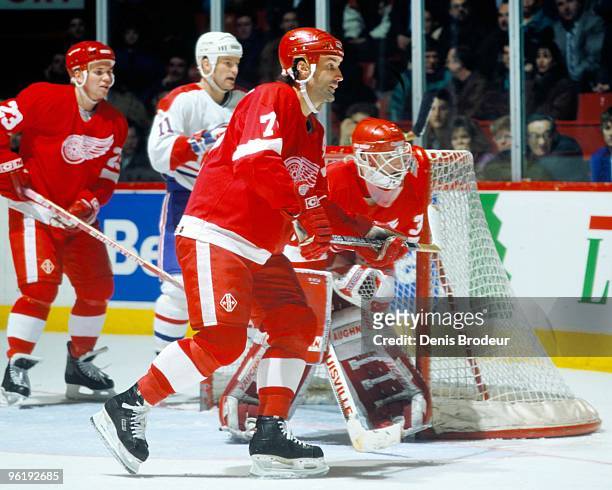 Paul Coffey of the Detroit Red Wings skates for the puck against the Montreal Canadiens in the mid-1990's at the Montreal Forum in Montreal, Quebec,...