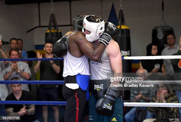 Jeff Horn and Ray Robinson embrace after a sparring session at Stretton Boxing Club on May 24, 2018 in Brisbane, Australia.