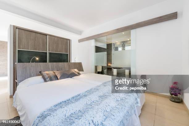 double bed in luxury hotel - pepmiba stock pictures, royalty-free photos & images