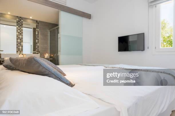 double bed in luxury hotel - pepmiba stock pictures, royalty-free photos & images