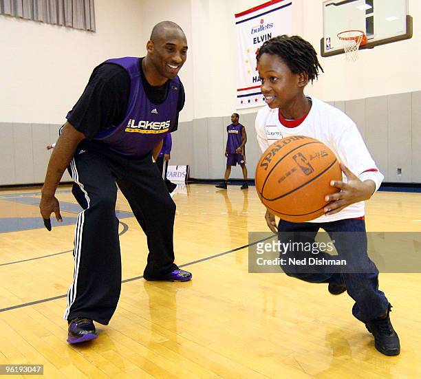 Of the Los Angeles Lakers during a fitness and basketball clinic with students from Stanton Elementary School at the Verizon Center on January 25,...