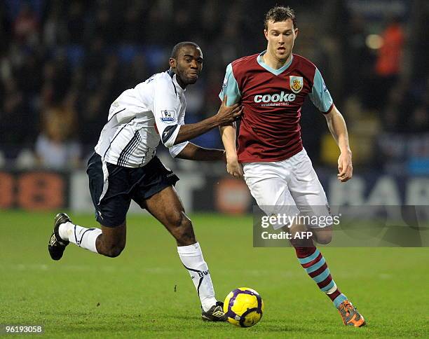 Bolton Wanderers' English midfielder Fabrice Muamba vies with Burnley's Scottish midfielder Kevin McDonald during the English Premier League football...