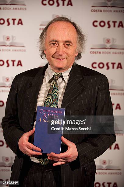 Christopher Reid winner of the Costa Award 2009 and Costa Poetry Award 2009 poses with the book A Scattering at the Costa Book Awards on January 26,...
