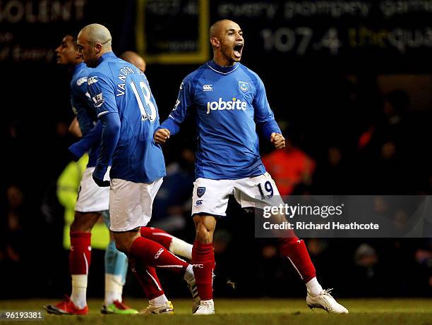 Danny Webber celebrates scoring the first goal for Pomey during the Barclays Premier League match between Portsmouth and West Ham United at Fratton...