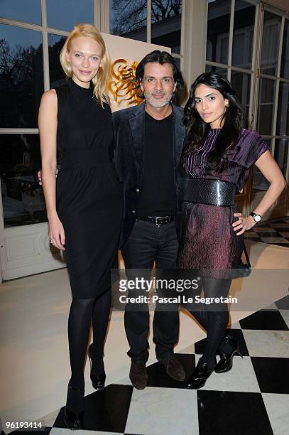 Anna Tokarska, Christophe Barratier and Geraldine Paz pose as they attends the Retrospective of Saint Hill & Von Basedow Haute Couture during Paris...