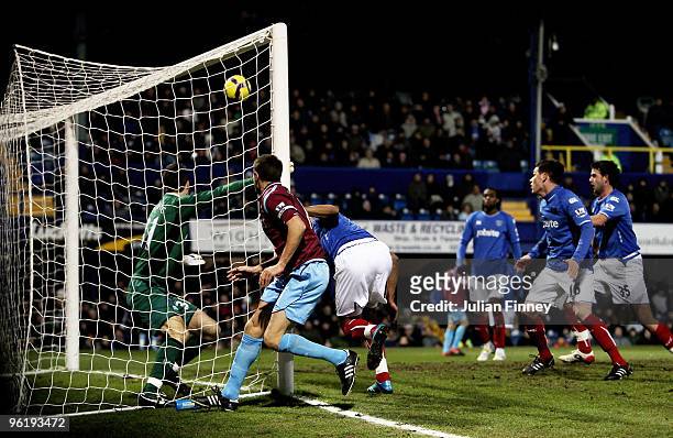 Matthew Upson of West Ham scores the first goal during the Barclays Premier League match between Portsmouth and West Ham United at Fratton Park on...