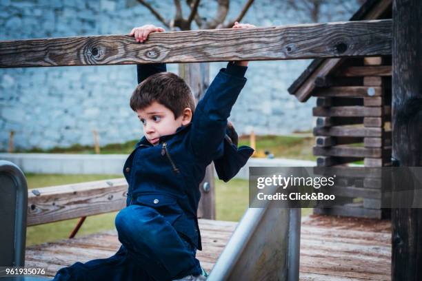 child on a slide - click&boo stock pictures, royalty-free photos & images