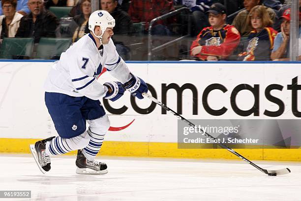 Ian White of the Toronto Maple Leafs skates with the puck against the Florida Panthers at the BankAtlantic Center on January 23, 2010 in Sunrise,...
