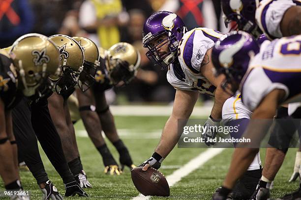 Offensive center John Sullivan of the Minnesota Vikings looks down the line of scrimmage as he gets set to snap the ball against the New Orleans...