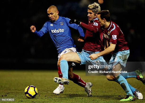 Valon Behrami of West Ham holds off Danny Webber of Pompey during the Barclays Premier League match between Portsmouth and West Ham United at Fratton...