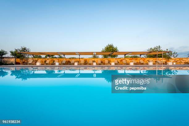luxury hotel swimmin pool in the morning - pepmiba stock pictures, royalty-free photos & images