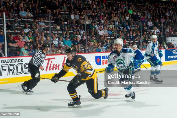 Robert Thomas of Hamilton Bulldogs is back checked by Glenn Gawdin of Swift Current Broncos at Brandt Centre - Evraz Place on May 21, 2018 in Regina,...