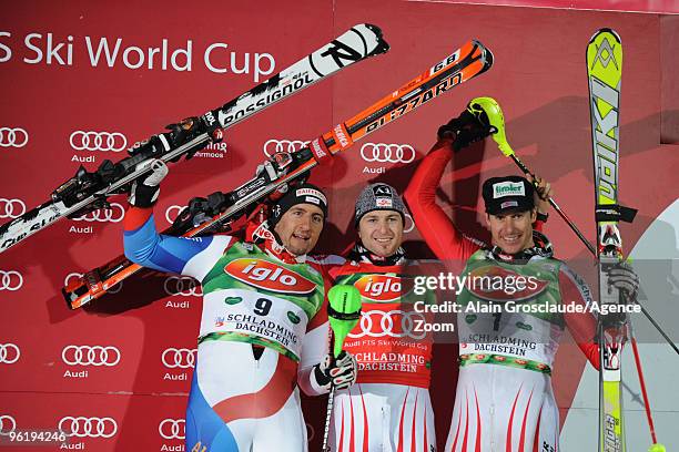 Silvan Zurbriggen of Switzerland, Reinfried Herbst of Austria, and Manfred Pranger celebrate during the podium portion of the Audi FIS Alpine Ski...