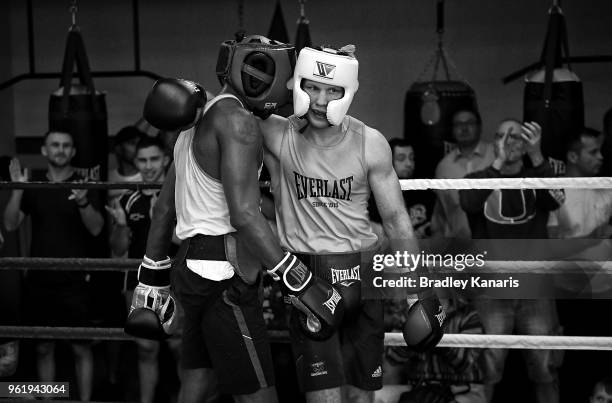 Jeff Horn and Ray Robinson embrace after a sparring session at Stretton Boxing Club on May 24, 2018 in Brisbane, Australia.