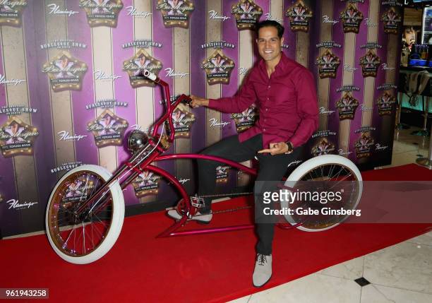 Professional BMX dirt jumper Ricardo Laguna poses with a custom made "X Burlesque" themed bicycle during the 16th anniversary event for "X Burlesque"...