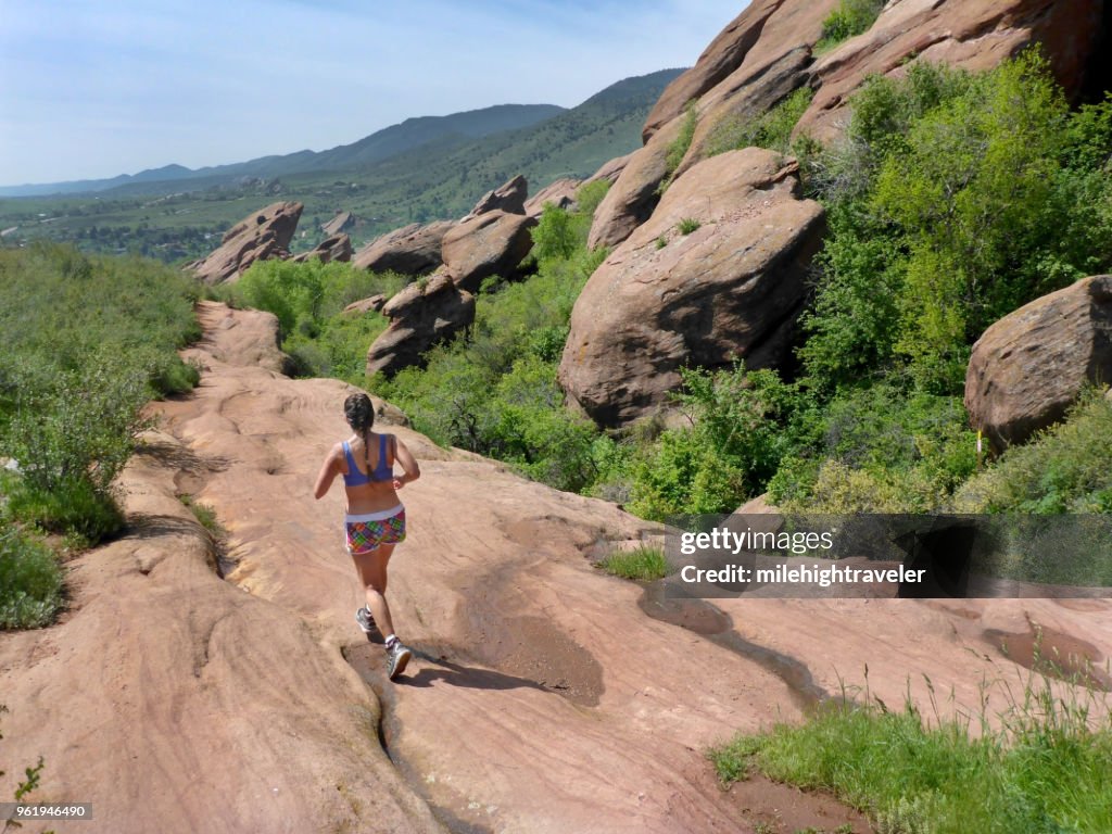 Woman running Trading Post Trail Red Rocks Park Morrison Colorado Rocky Mountains