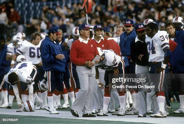 Head Coach Chuck Knox of the Buffalo Bills with his game plan in hand walking up the sidelines during an early circa 1980's NFL football game. Knox...