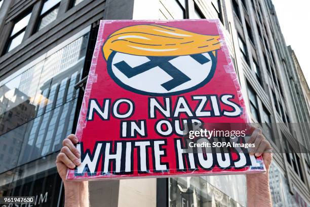 No Nazis in our White House" sign at a protest rally against Donald Trump outside the Lotte New York Palace Hotel in New York City. Protesters took...