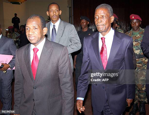 Guinea's new interim Prime Minister Jean-Marie Dore and General Sekouba Konate, president of the transition government walk on January 26, 2010 in...