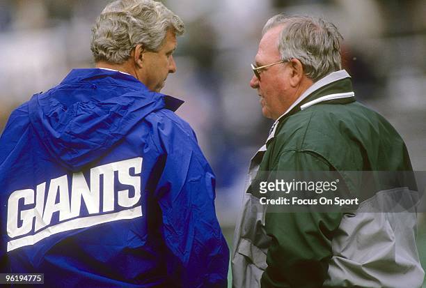 S: Head Coach Buddy Ryan of the Philadelphia Eagles talking with head coach Bill Parcells of the New York Giants before a late circa 1980;s NFL...