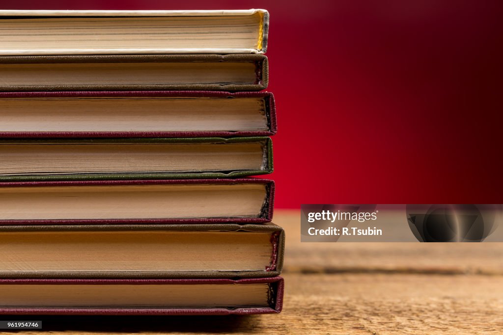 Books on wooden table close up photo