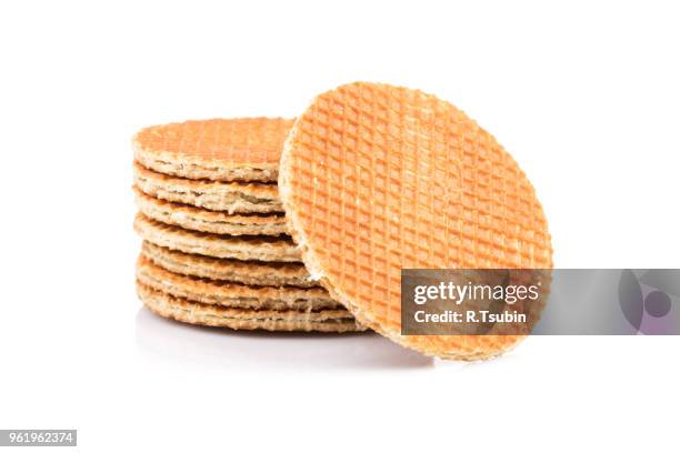 dutch waffle isolated on a white background - stroopwafel stockfoto's en -beelden