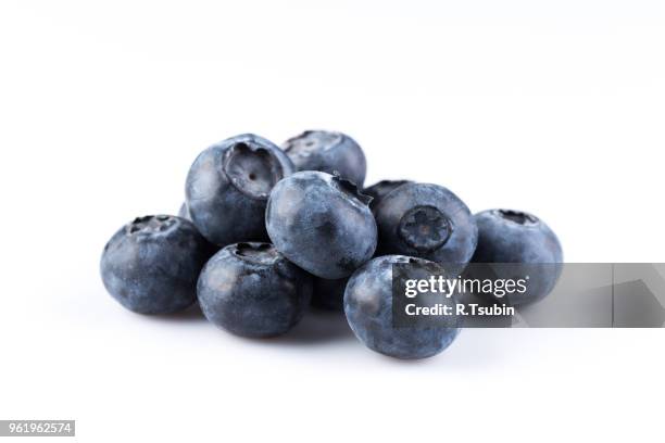 group of fresh juicy blueberries isolated on white background - huckleberry stock pictures, royalty-free photos & images