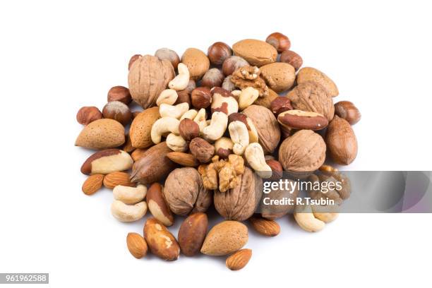 variety of mixed nuts isolated on white background - pecan nut stock pictures, royalty-free photos & images