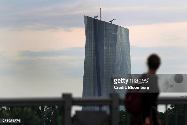 Pedestrian looks towards the European Central Bank skyscraper headquarters in Frankfurt, Germany, on Wednesday, May 23, 2018. Frankfurt has emerged...