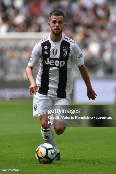 Miralem Pjanic of Juventus in action during the Serie A match between Juventus and Hellas Verona FC at Allianz Stadium on May 19, 2018 in Turin,...