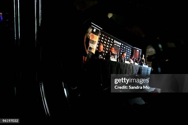 Reflection through a mirror shows boxer David Tua and his promoters during a press conference ahead of the fight night bout between David Tua and...