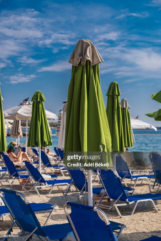 Closed beach umbrellas