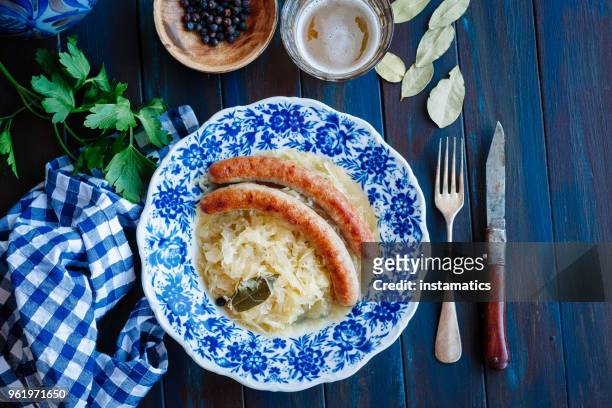 bratwurst mit sauerkraut - german culture stock-fotos und bilder