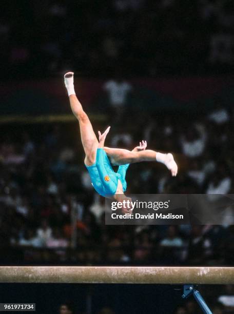 Peggy Wunsche of the German Democratic Republic competes in the balance beam event of the gymnastics competition of the 1990 Goodwill Games held from...