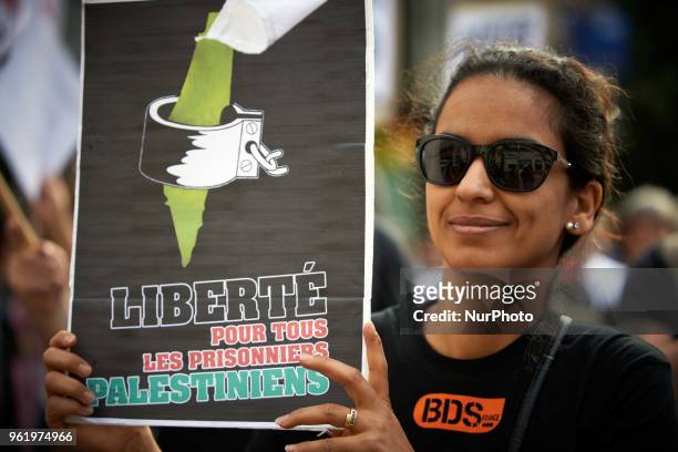 Woman holds a placard reading 'Freedom for all palestinians prisoners'. People gathered in front of the Chamber of Commerce and Industry of Toulouse...