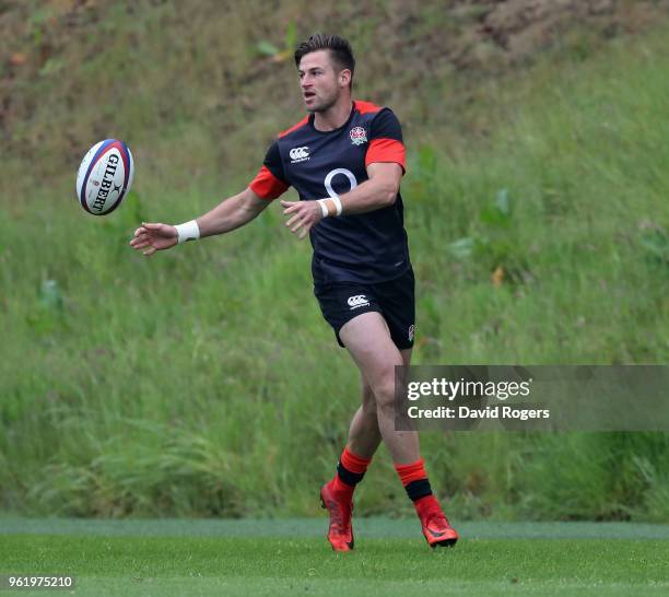 Henry Trinder passes the ball during the England training session held at Pennyhill Park on May 24, 2018 in Bagshot, England.