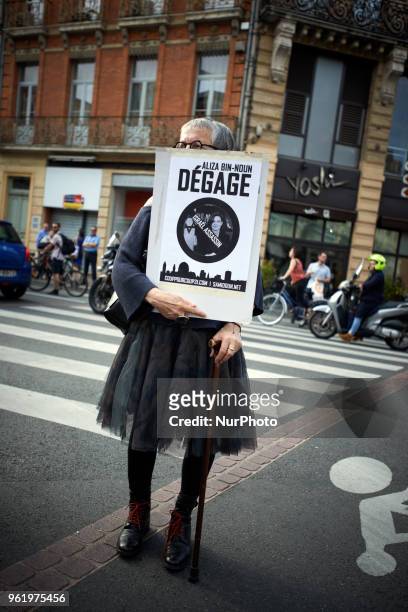 Woman holds a placard reading 'Aliza Bin-Noun get out !'. People gathered in front of the Chamber of Commerce and Industry of Toulouse in protest to...
