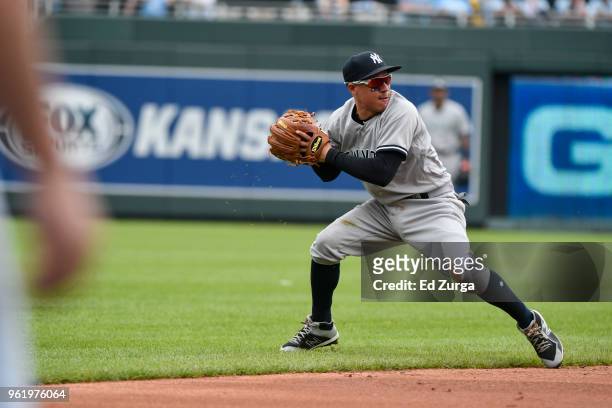 Ronald Torreyes of the New York Yankees throws to first against the Kansas City Royals at Kauffman Stadium on May 20, 2018 in Kansas City, Missouri.