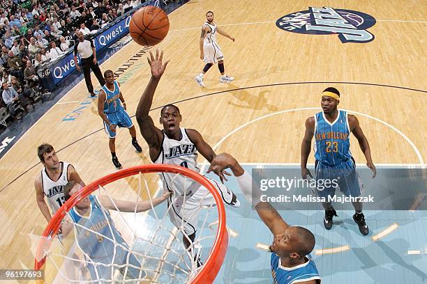 Ronnie Brewer of the Utah Jazz puts up a shot against David West of the New Orleans Hornets during the game at the EnergySolutions Arena on January...